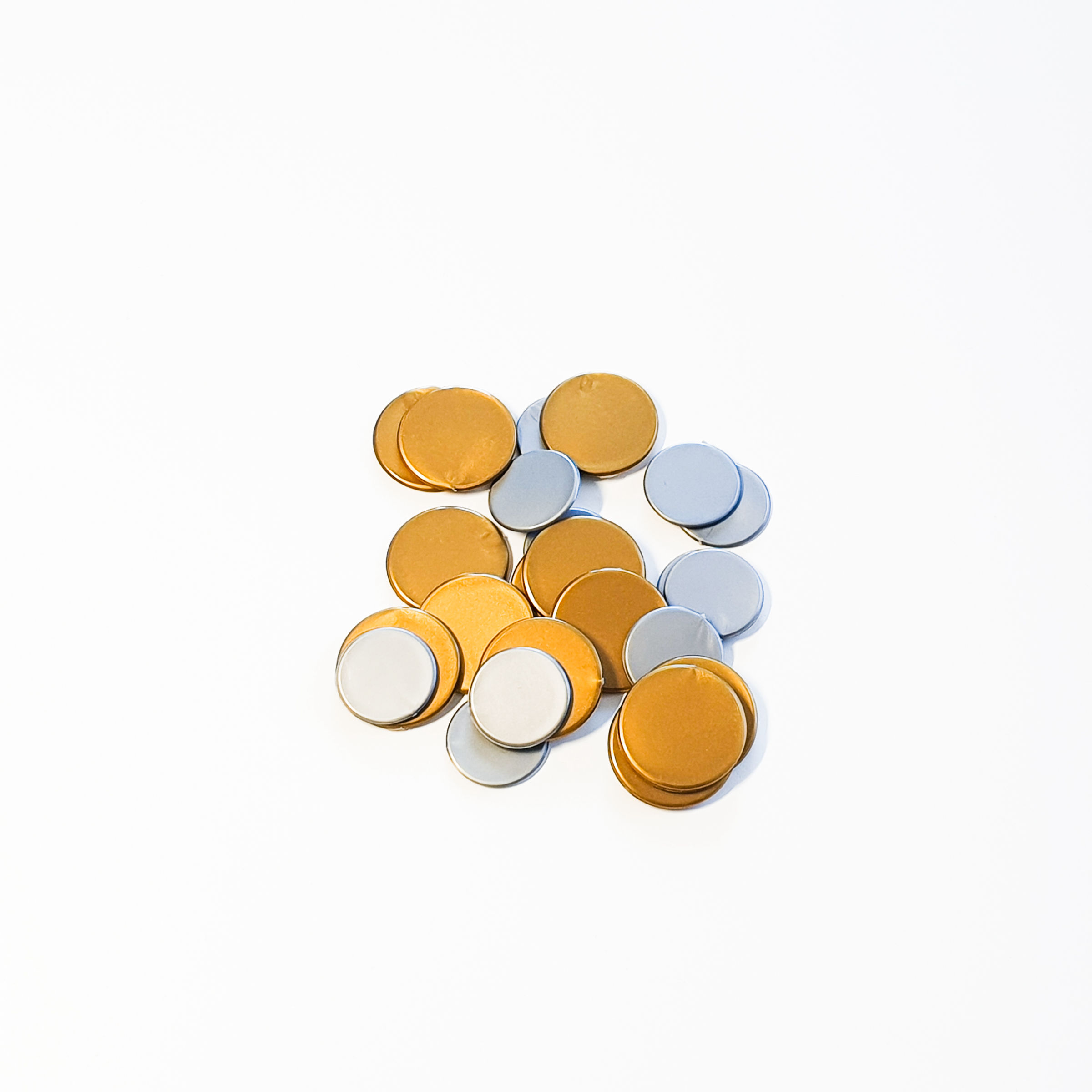 Plastic coin tokens in gold and silver colours